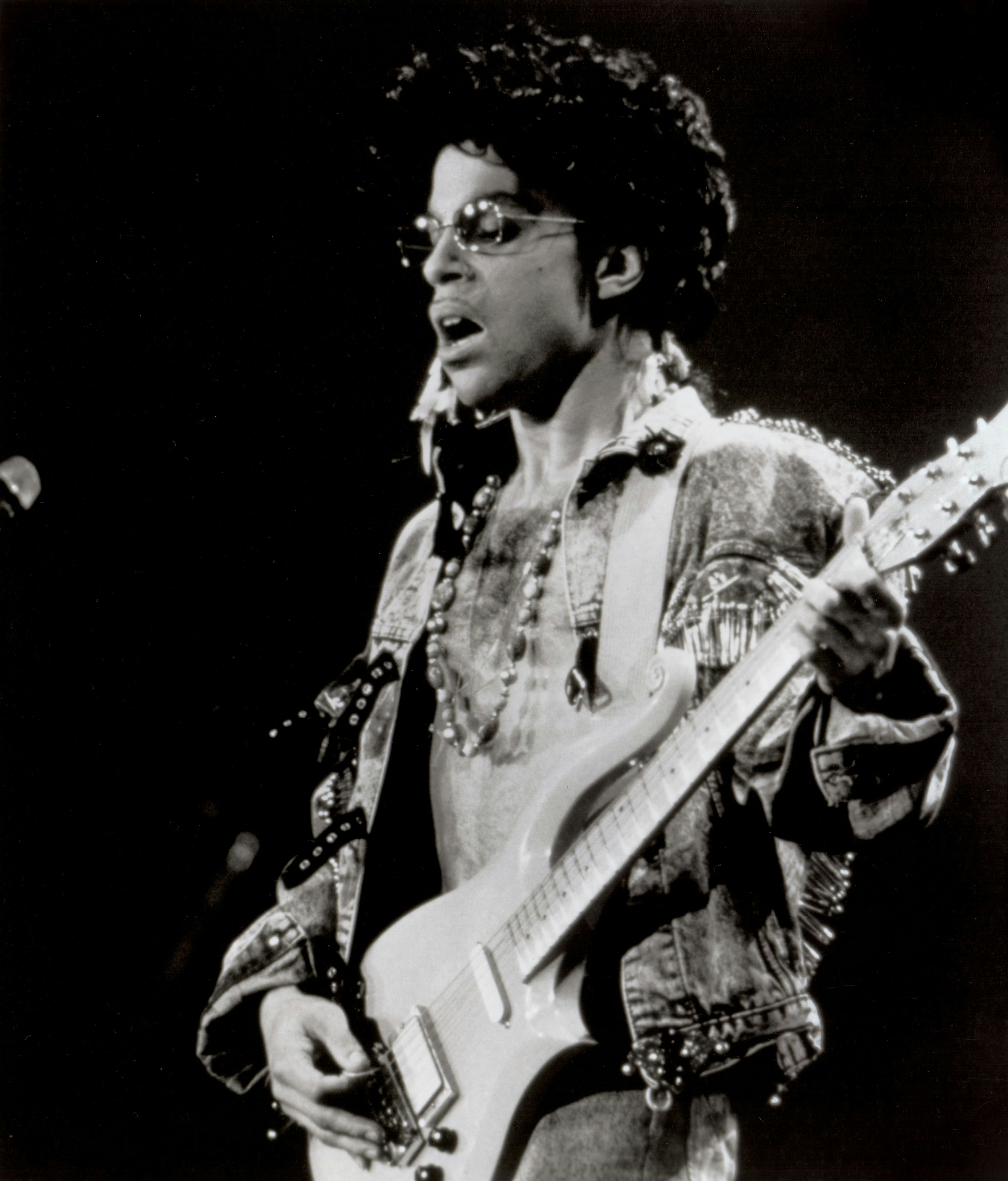 Prince in concert. Promotional photos for the concert film <i>Sign "O" the Times</i>.